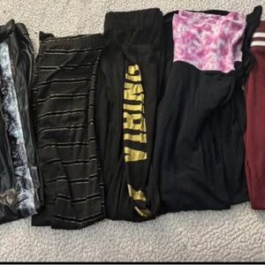 11 pairs of various leggings and bottoms